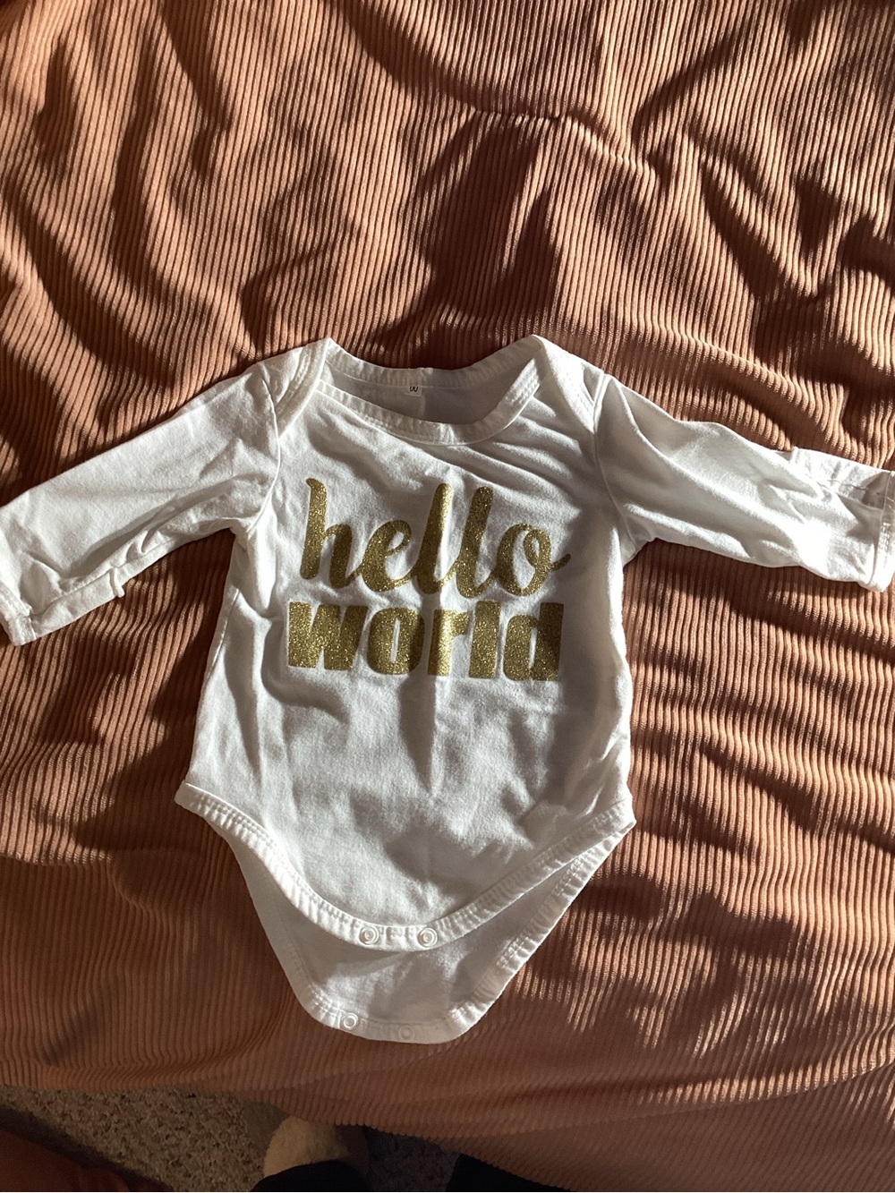 White Long-Sleeve Baby Bodysuit with Gold 'hello world' Text hand covers